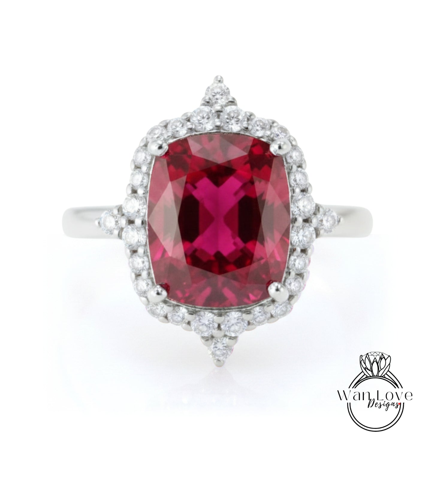 A stunning ring featuring a large, deep red gemstone surrounded by a halo of smaller diamonds, set in a silver band.