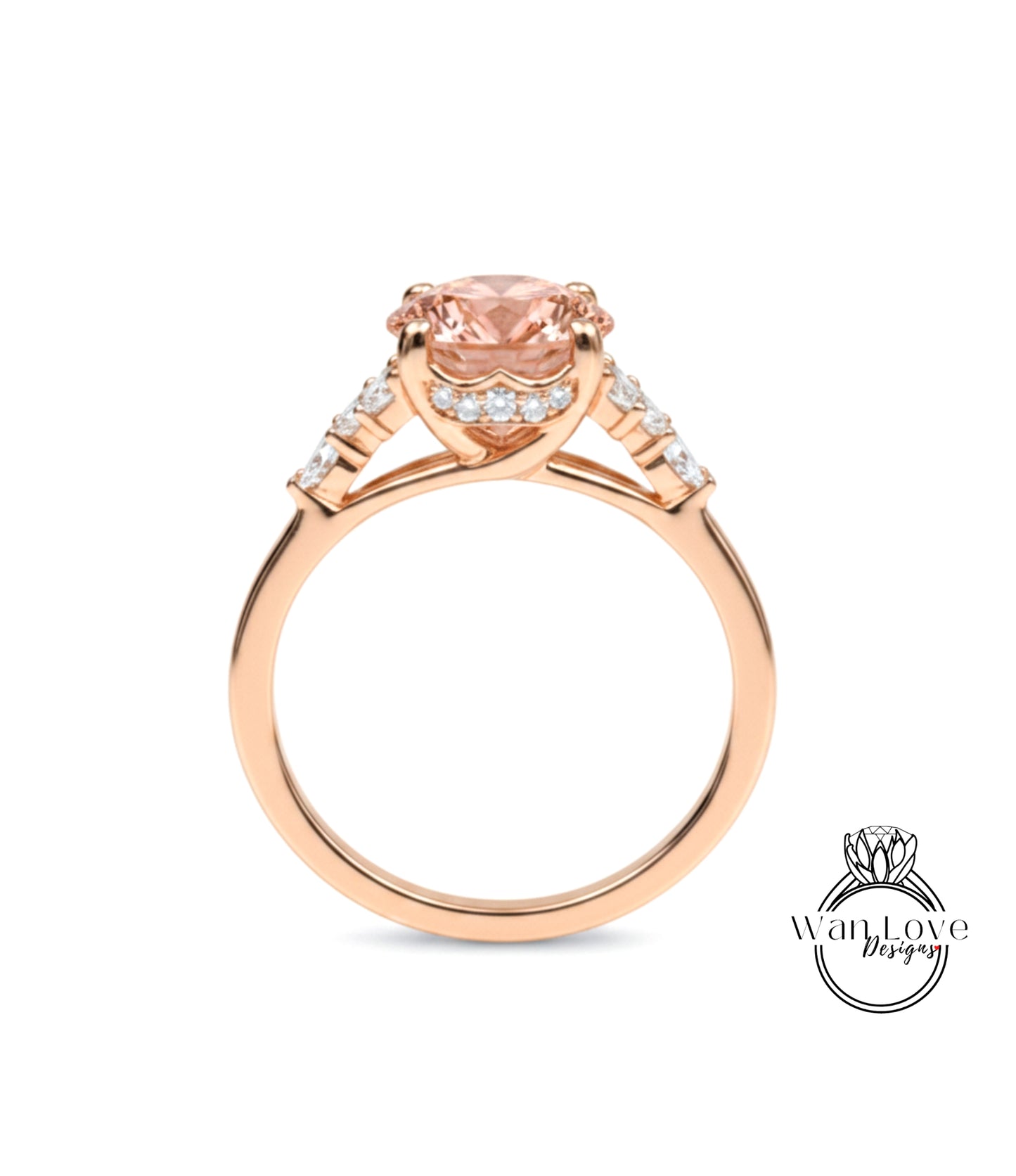 A gold ring with a large pink gemstone set in the center, surrounded by smaller diamonds.