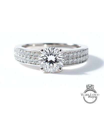 A close-up view of a diamond engagement ring with a large central diamond surrounded by smaller diamonds set in a band.