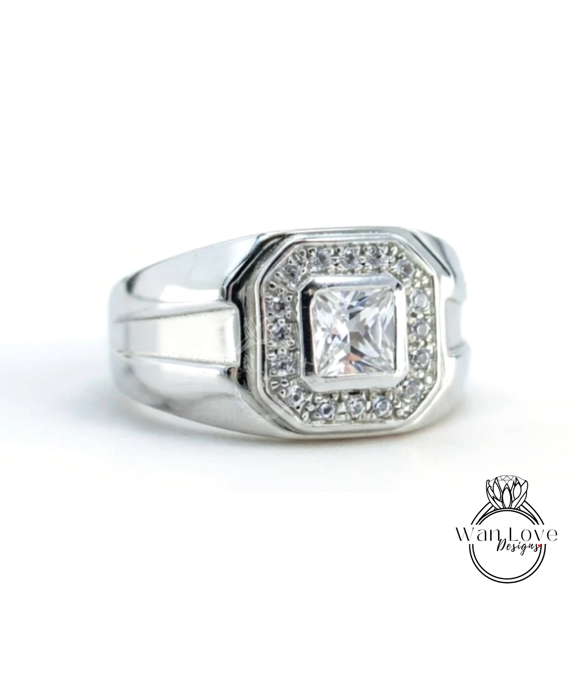 A silver ring with a large diamond in the center, surrounded by smaller diamonds.