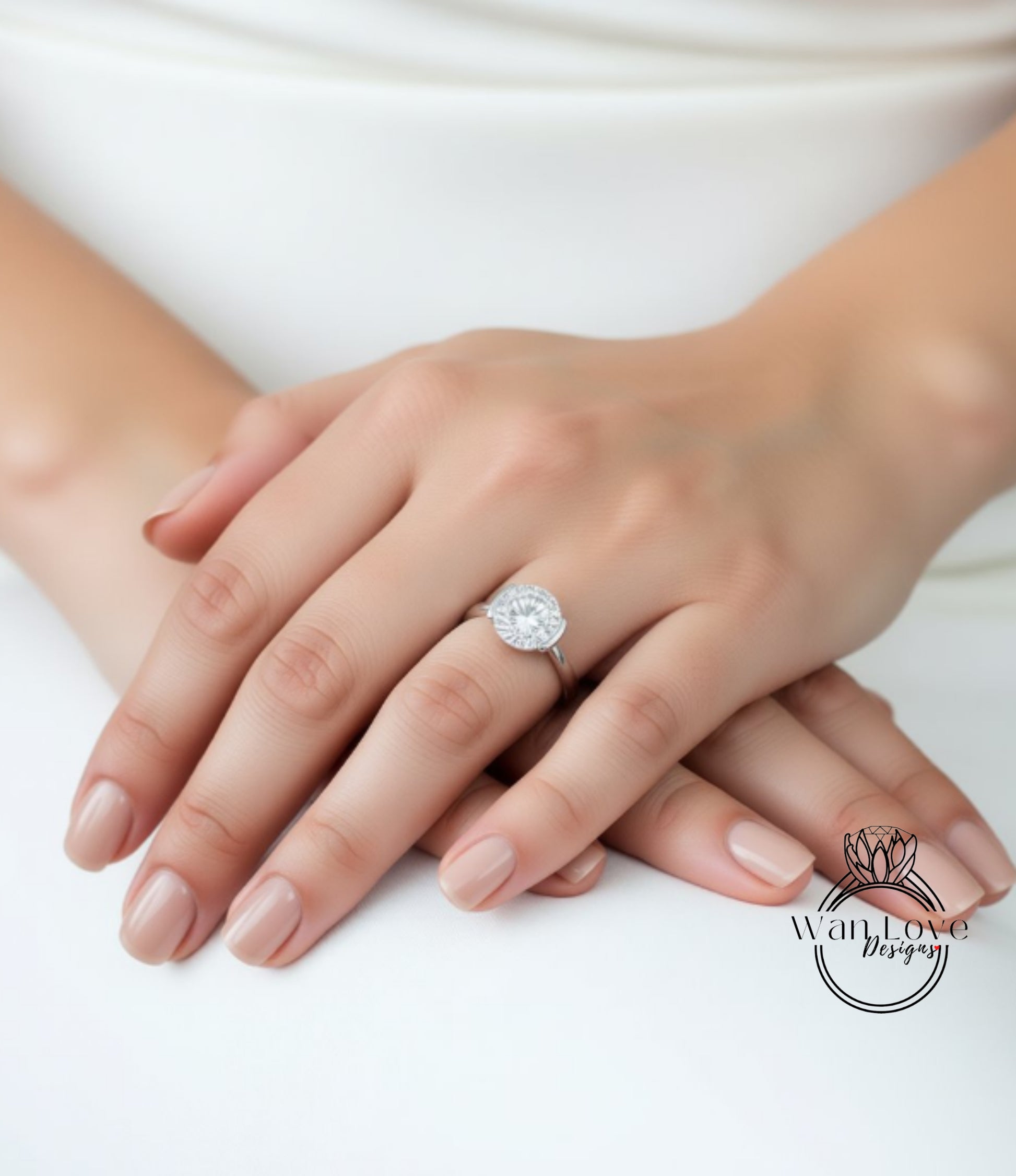 A close-up of a person's hands wearing a large diamond engagement ring.