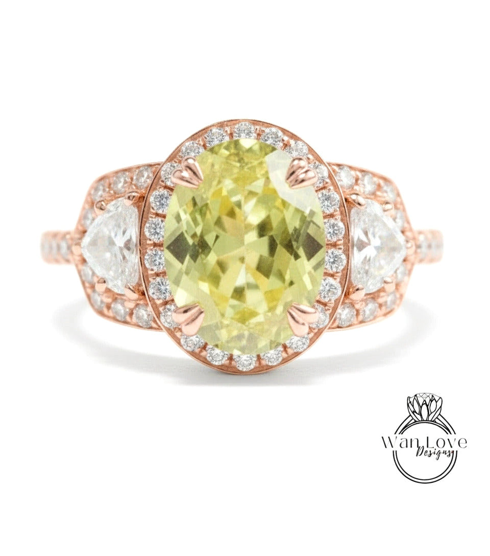 A rose gold ring with a large oval-shaped gemstone at the center, surrounded by smaller diamonds.