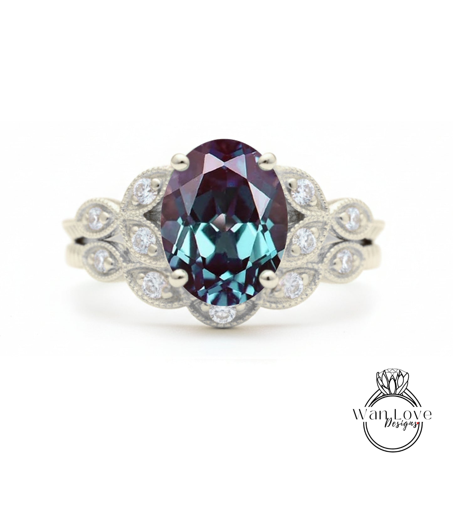 a silver ring with a large oval-shaped gemstone, likely a sapphire, surrounded by smaller diamonds.
