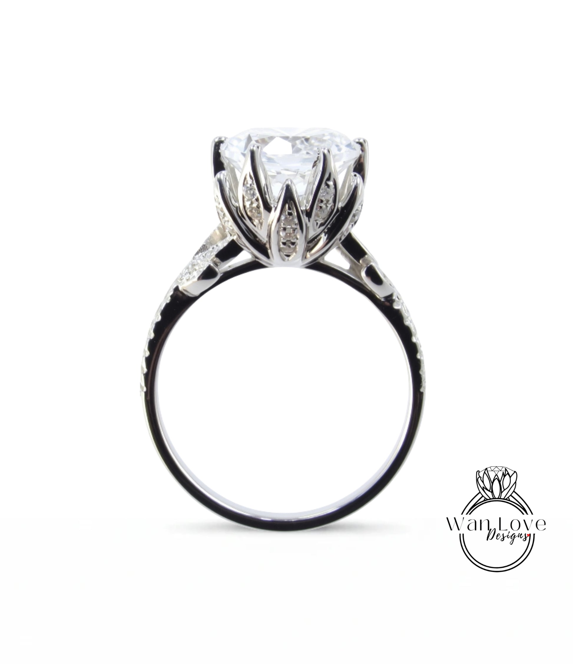 A close-up view of a silver ring with a large, clear gemstone set in the center.