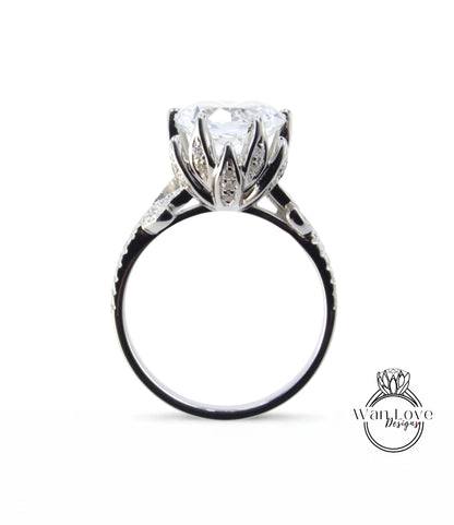 A close-up view of a silver ring with a large, clear gemstone set in the center.