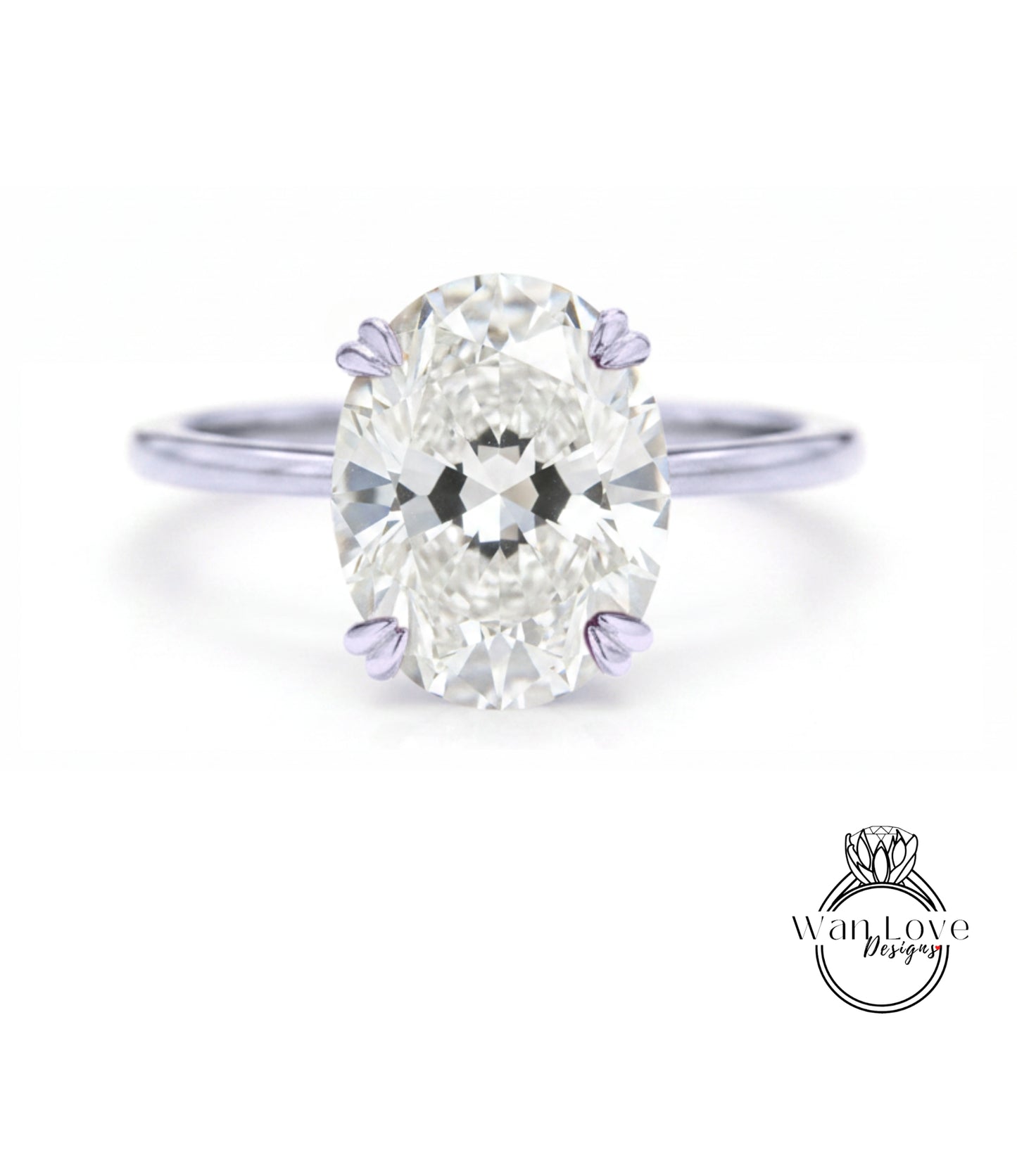 A close-up of a diamond engagement ring with a large oval-shaped diamond set in a silver band.