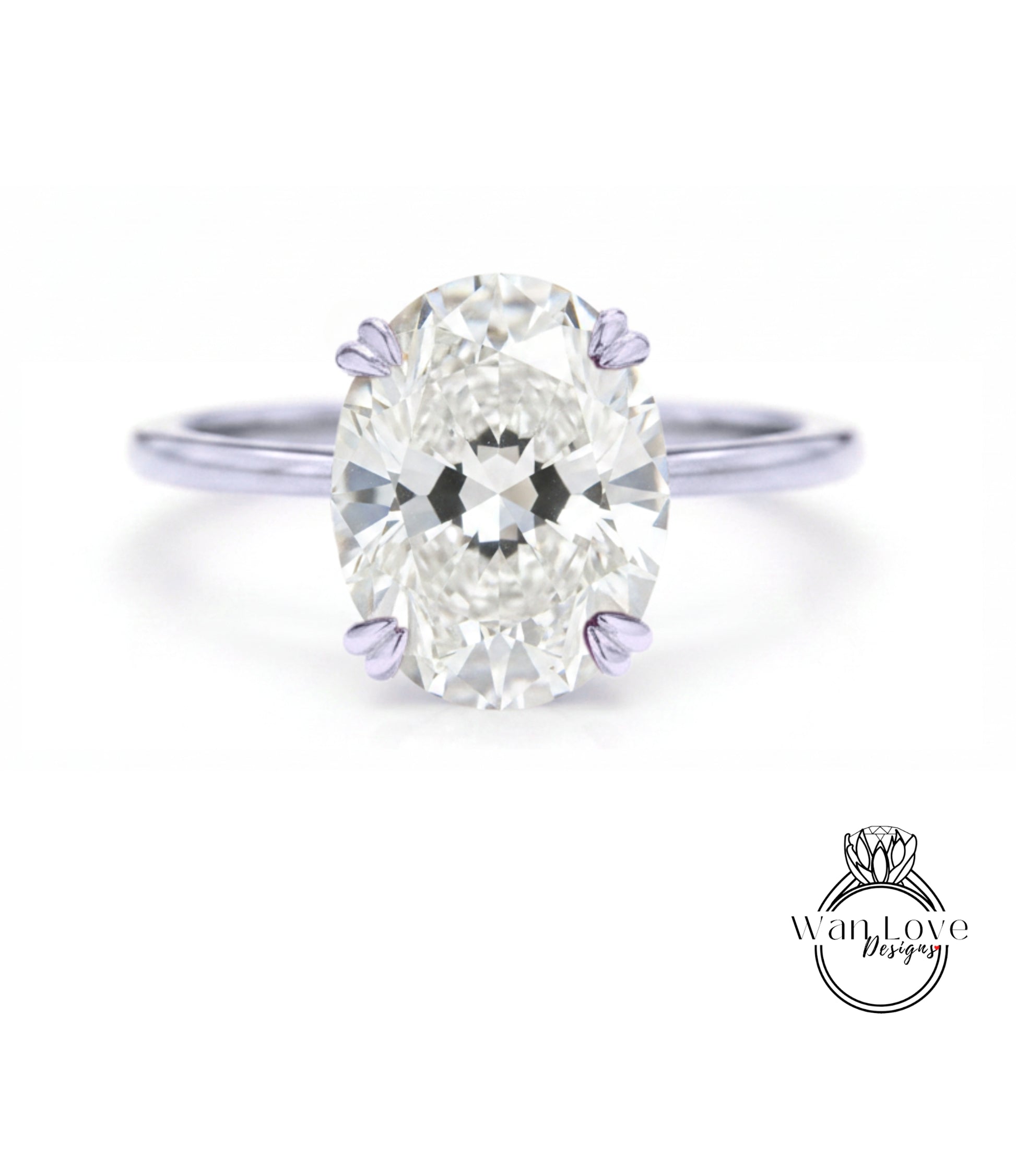 A close-up of a diamond engagement ring with a large oval-shaped diamond set in a silver band.
