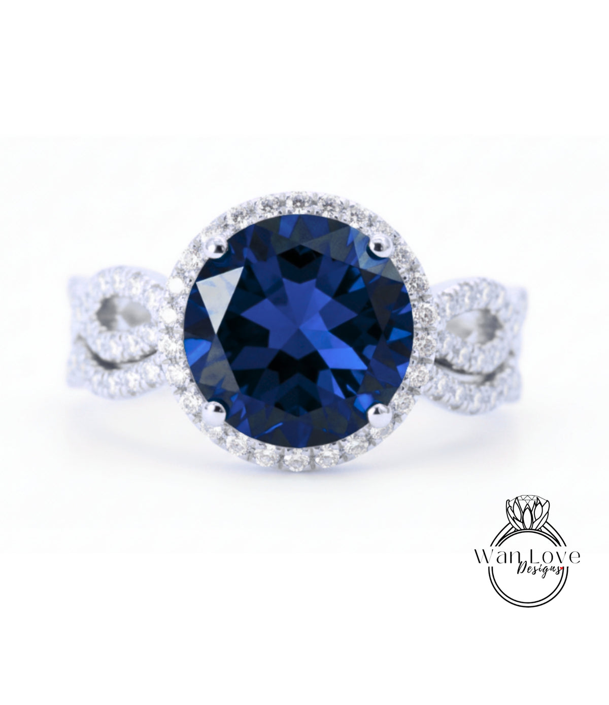 A stunning blue gemstone ring with a halo of diamonds around the center stone.