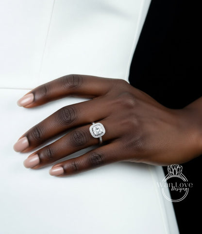 A close-up of a hand wearing a diamond engagement ring.