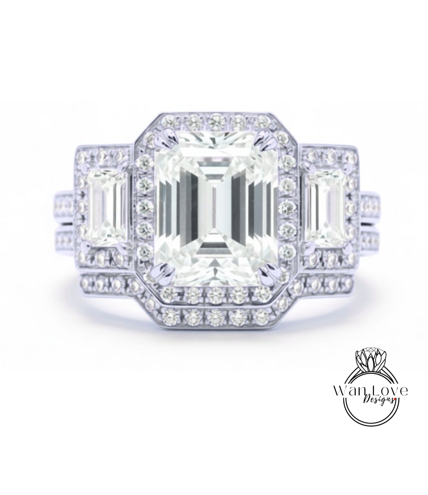 A stunning diamond engagement ring with a large central diamond surrounded by smaller diamonds on either side, set in a silver band.