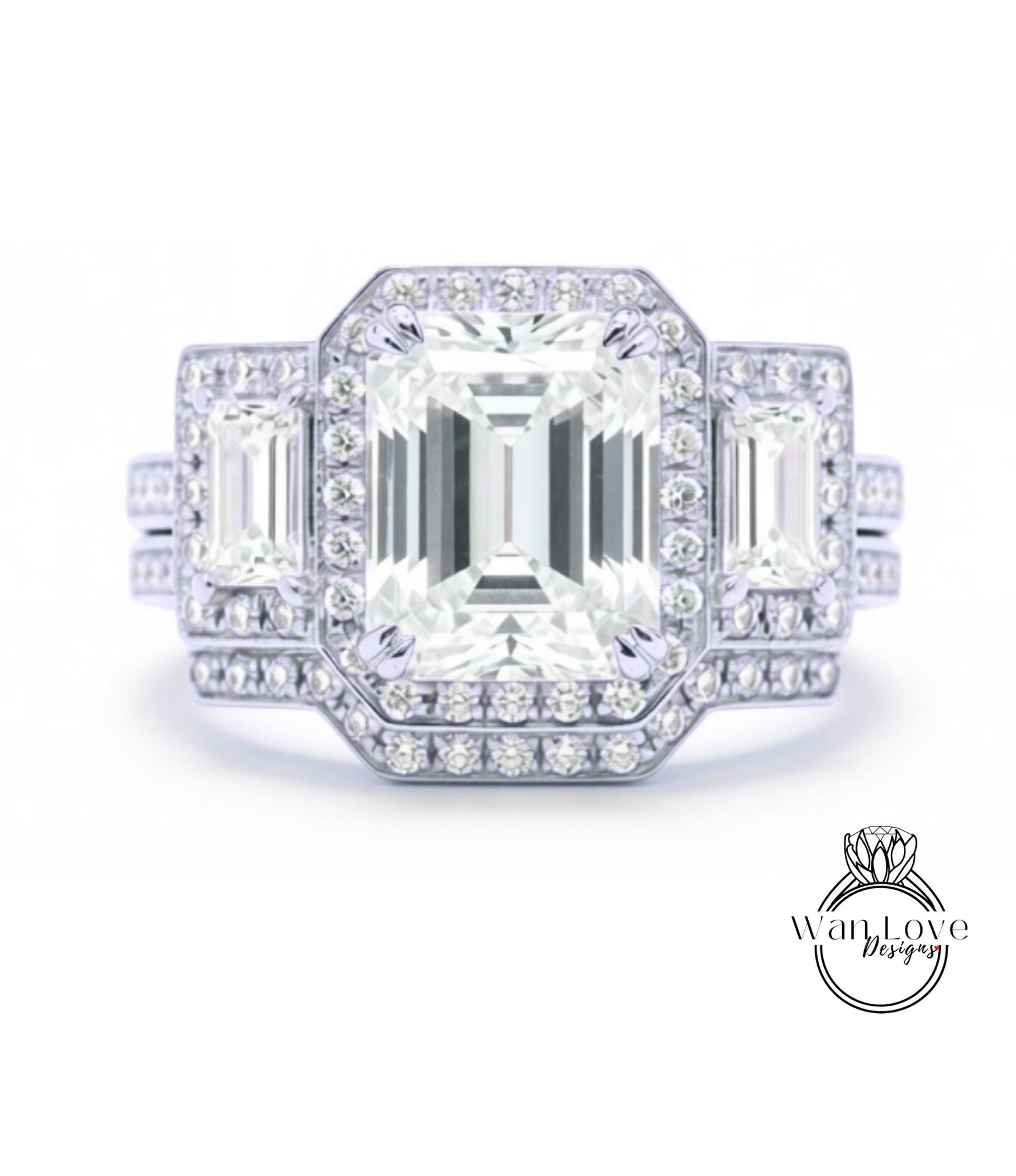 A stunning diamond engagement ring with a large central diamond surrounded by smaller diamonds on either side, set in a silver band.