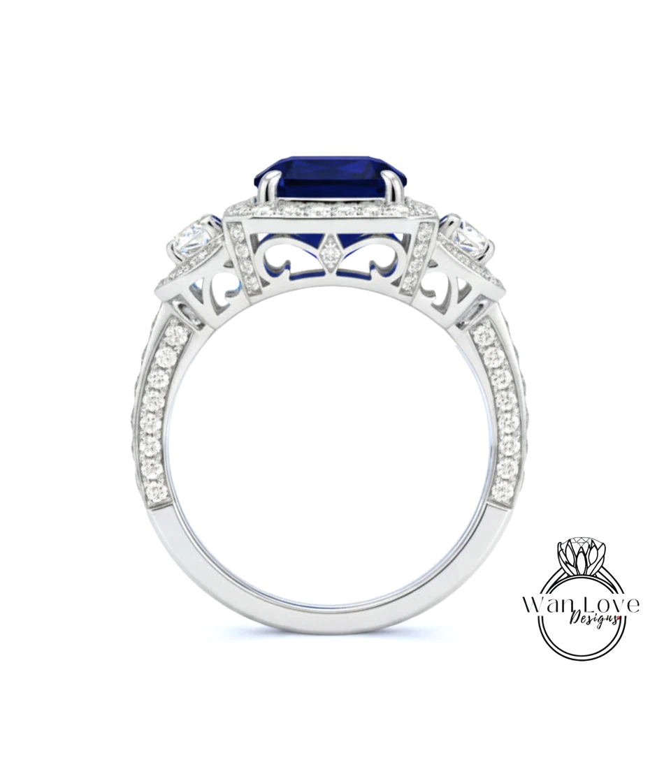 A silver ring with a large blue gemstone, surrounded by smaller diamonds and intricate designs.