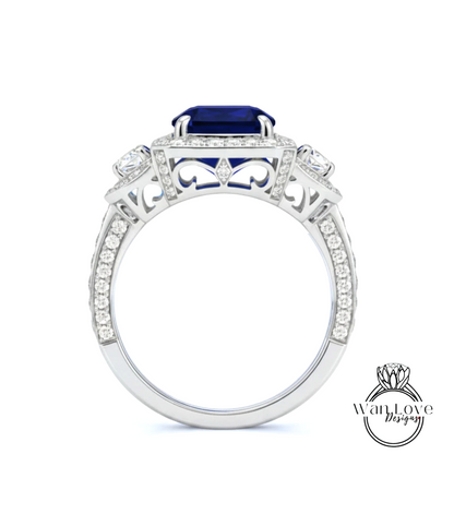 A silver ring with a large blue gemstone, surrounded by smaller diamonds and intricate designs.
