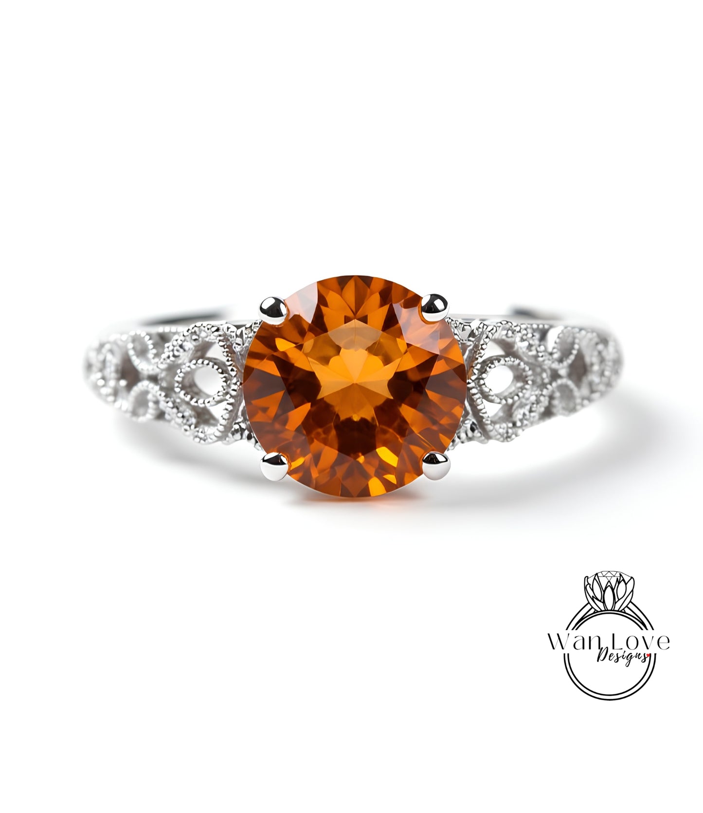 a ring with a large, round, orange gemstone set in a silver band.