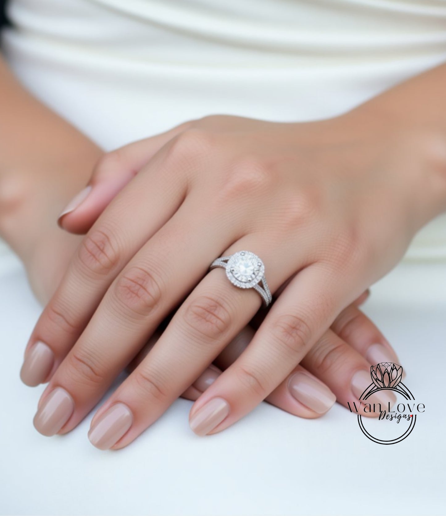 A close-up of a person's hands wearing a diamond engagement ring.