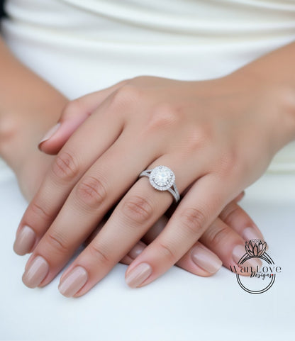 A close-up of a person's hands wearing a diamond engagement ring.