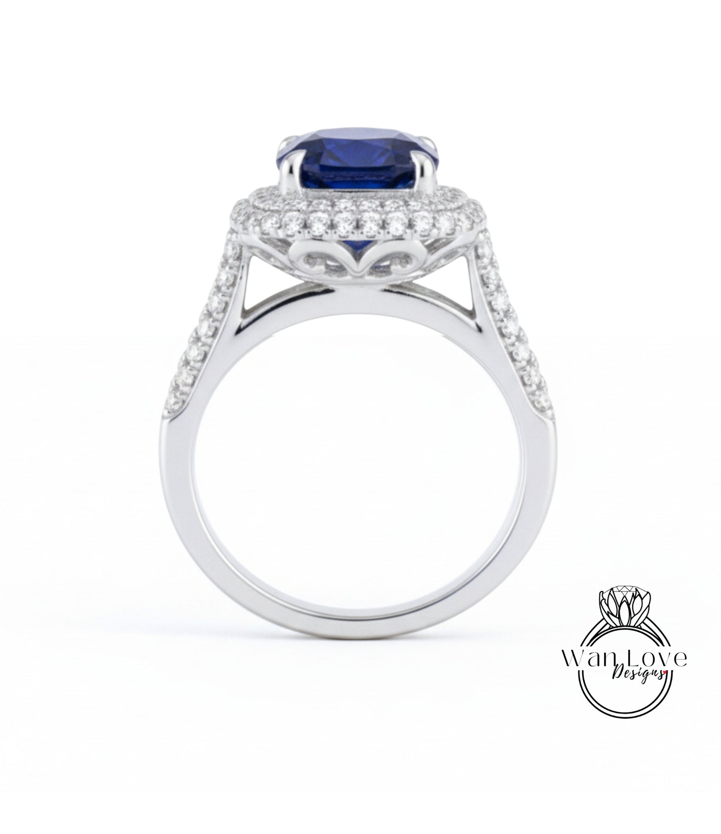 A silver ring with a large blue gemstone, likely a sapphire, set in a halo of smaller diamonds.