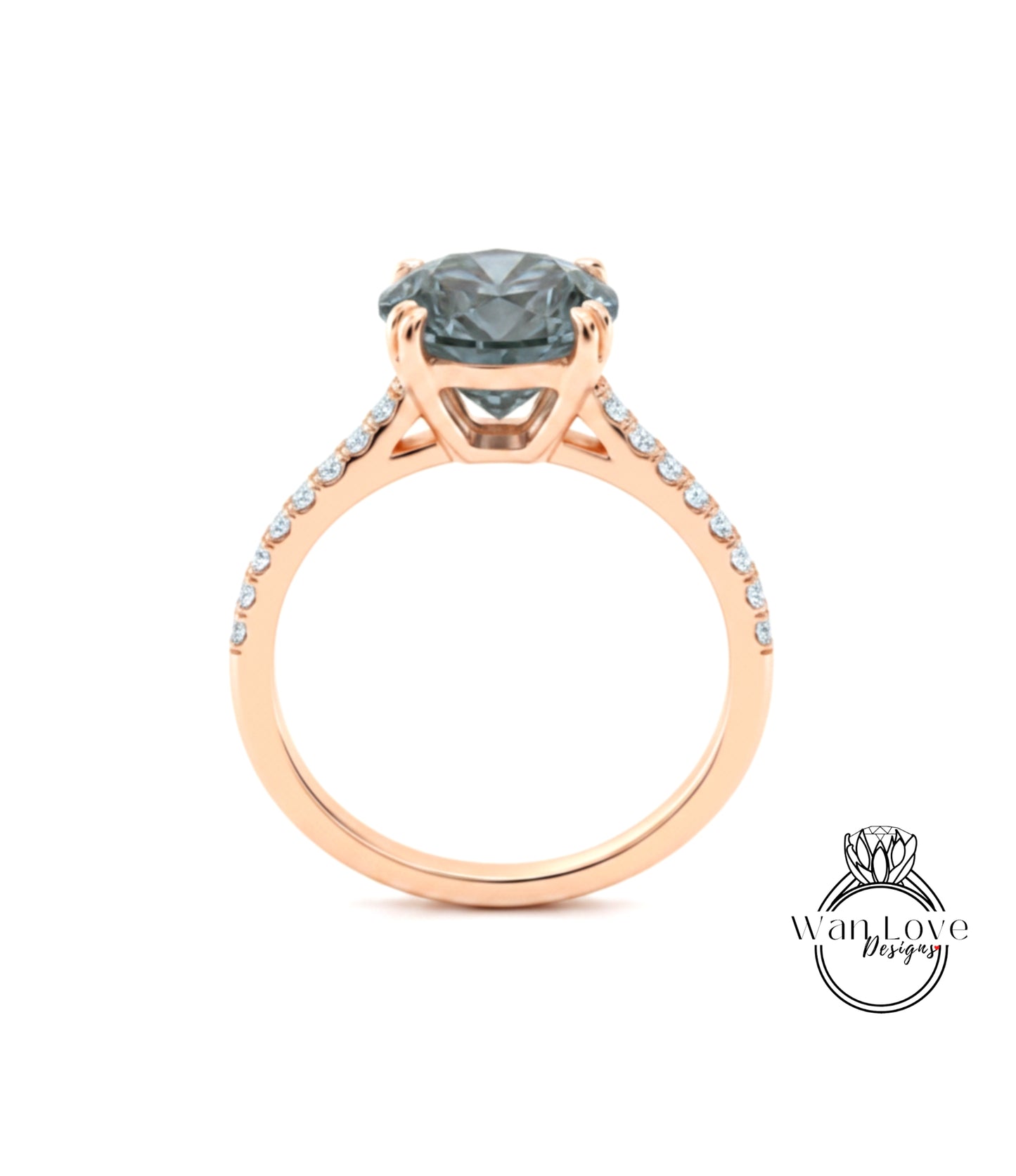 A rose gold engagement ring with a large, dark blue gemstone set in the center.
