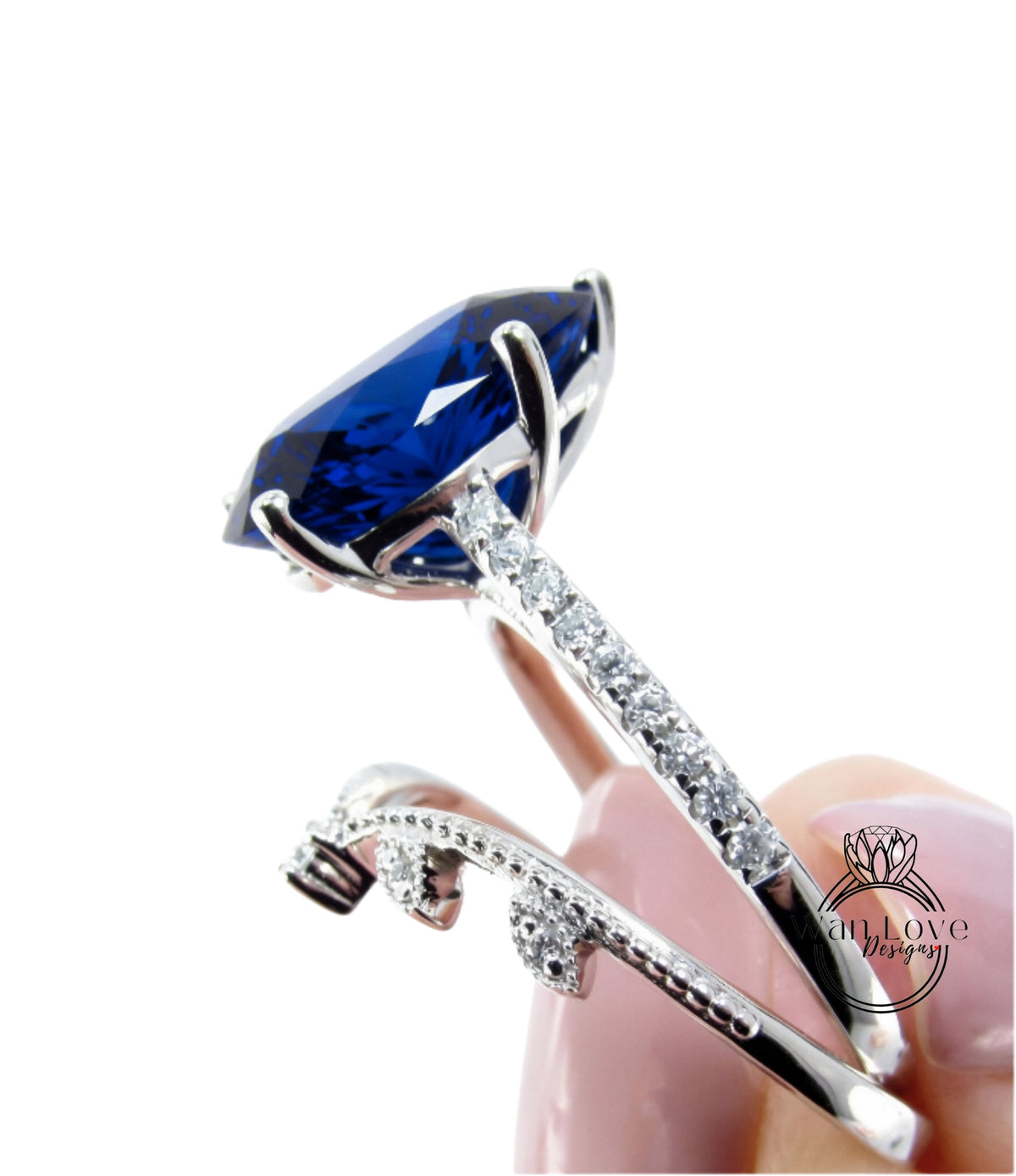 A close-up view of a diamond engagement ring with a large blue gemstone set in a silver band.