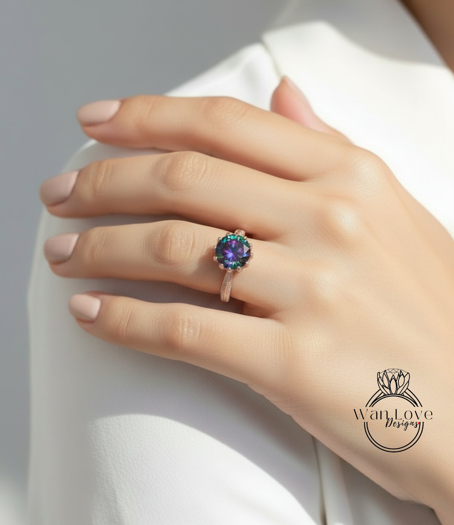 A close-up of a person's hand wearing a ring with a large, colorful gemstone.