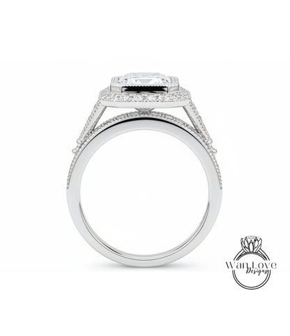 A silver engagement ring with a large diamond center stone.