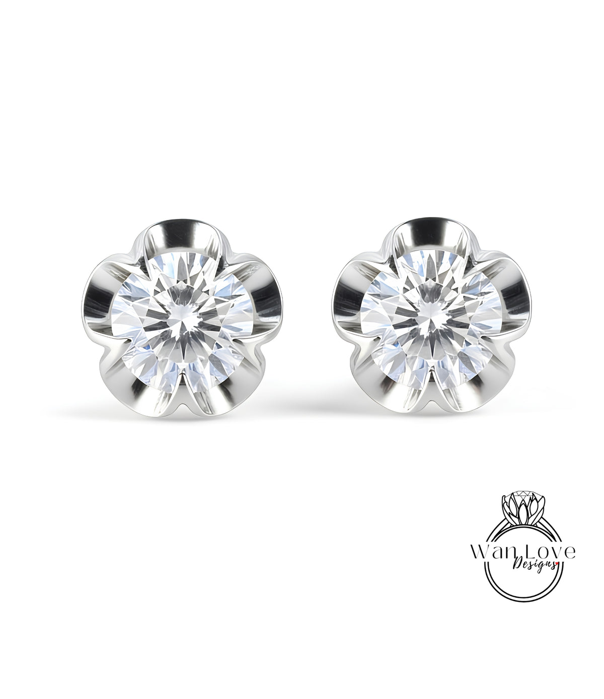A pair of elegant earrings with a large, brilliant-cut diamond set in a silver flower-shaped design.