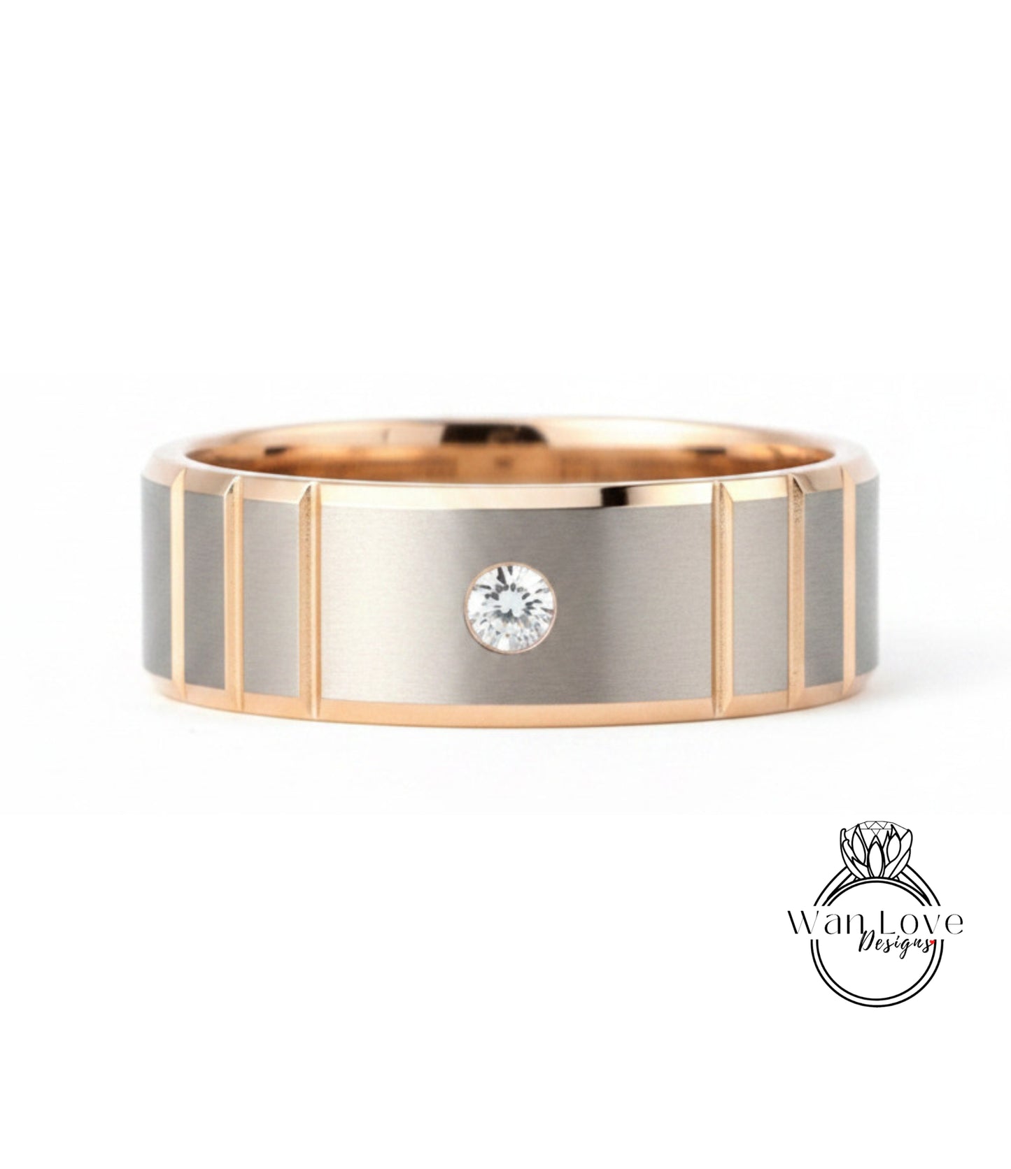 A gold and silver ring with a large diamond set in the center.