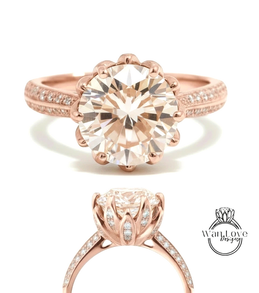 a beautiful rose gold engagement ring with a large, round diamond set in the center. The ring has a scalloped band and is adorned with small diamonds around the band.