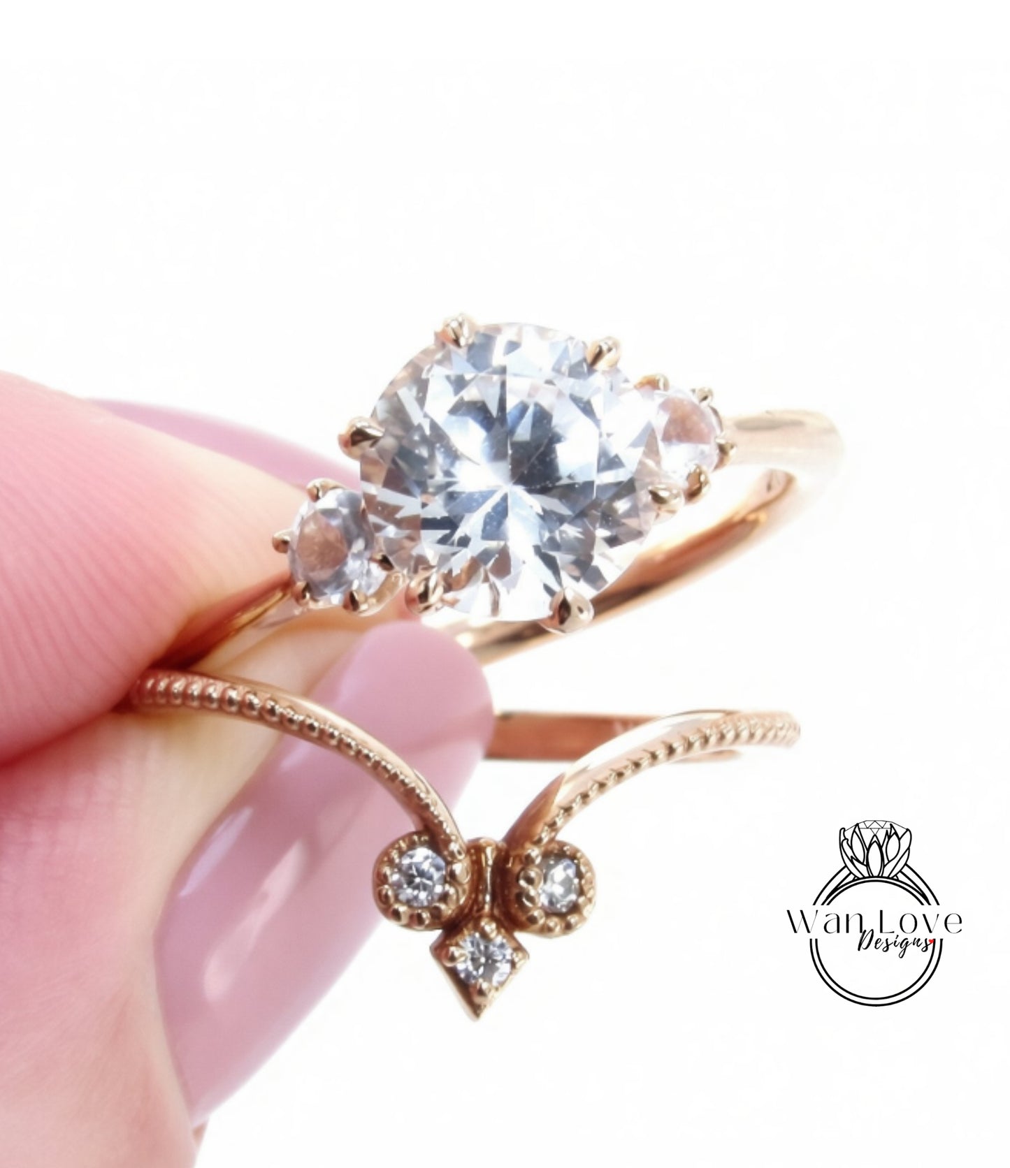 A close-up image of a person's hand holding a gold ring with a large diamond set in the center, surrounded by smaller diamonds.