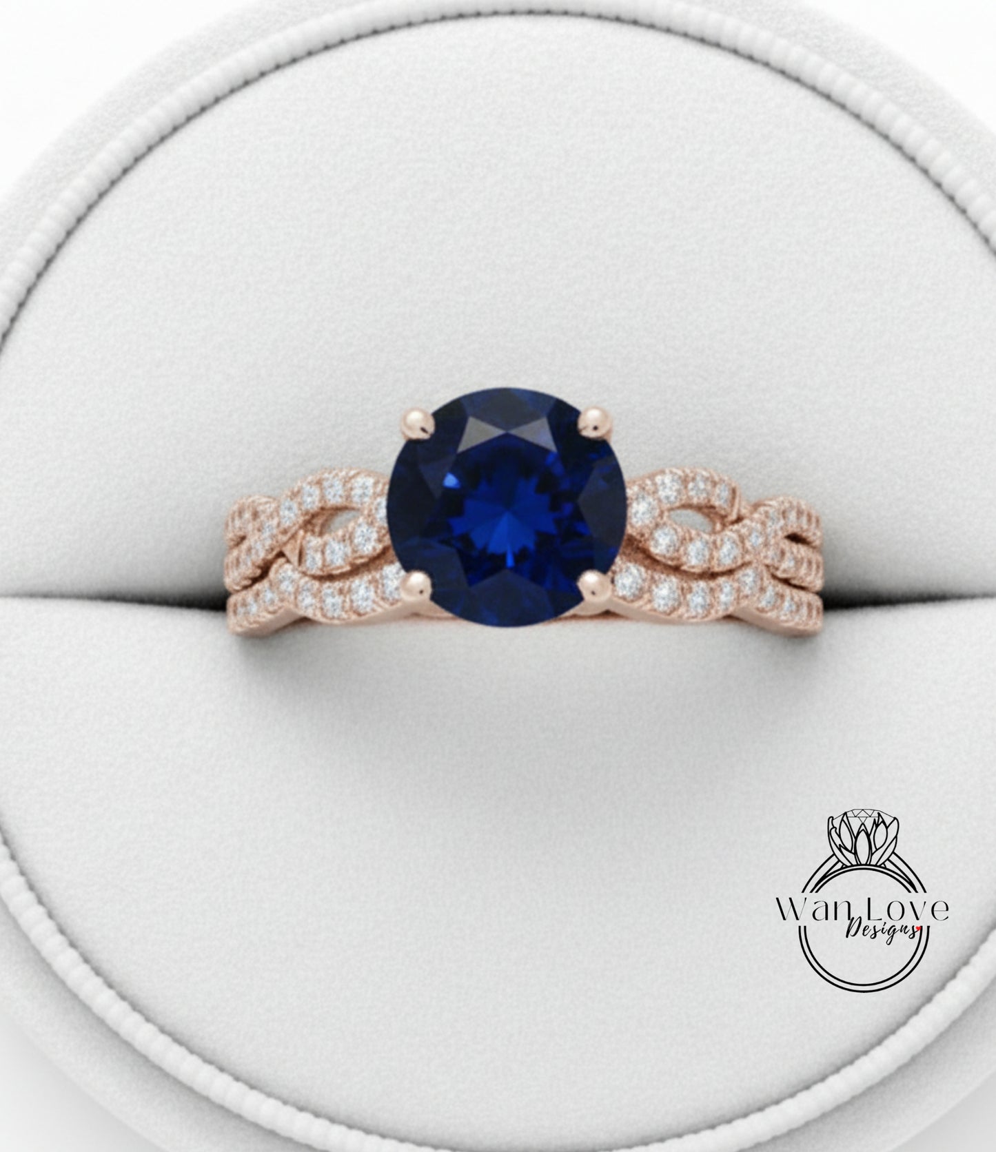 A gold ring with a large blue gemstone, possibly a sapphire, set in a delicate, intricate design.