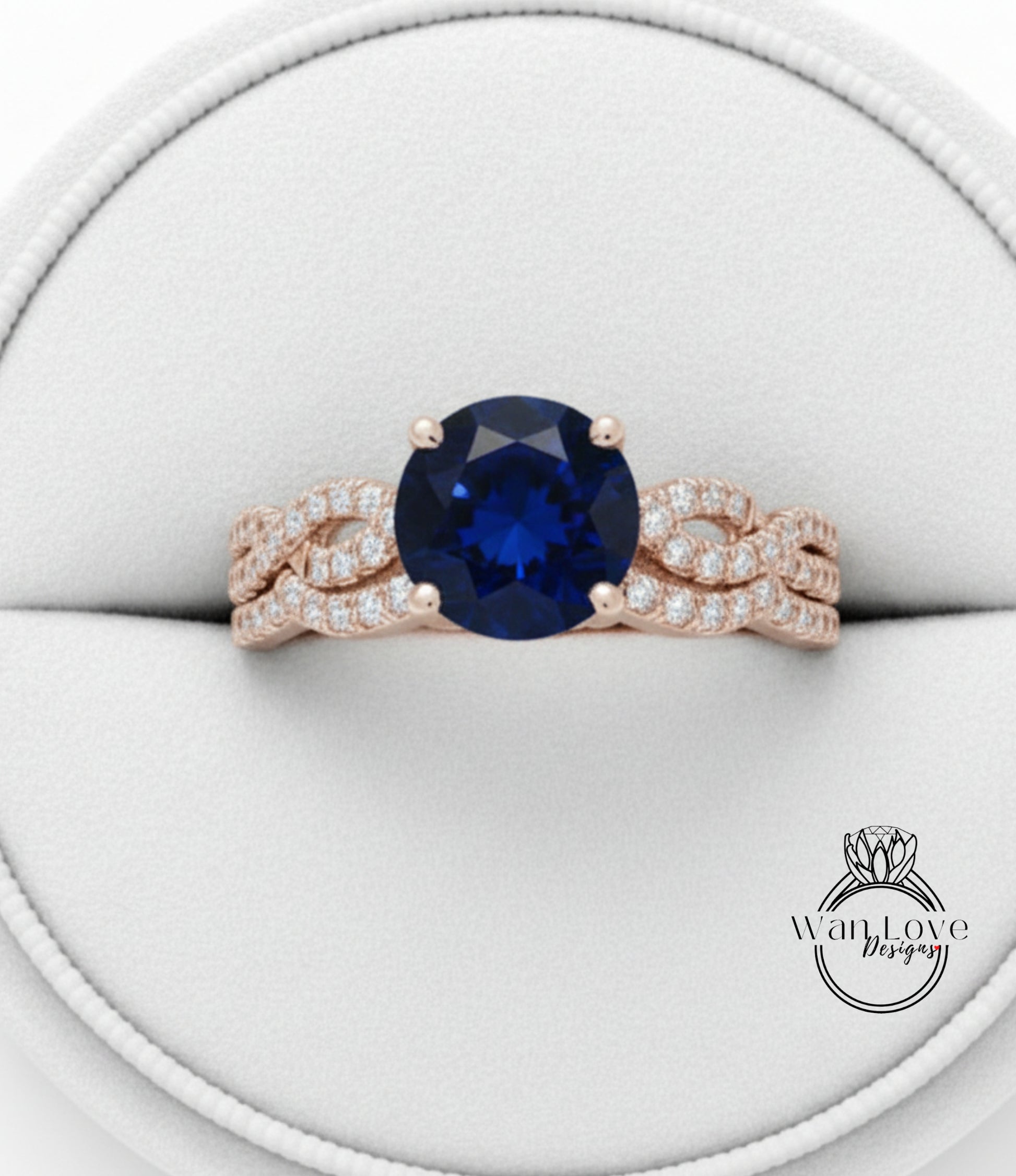 A gold ring with a large blue gemstone, possibly a sapphire, set in a delicate, intricate design.