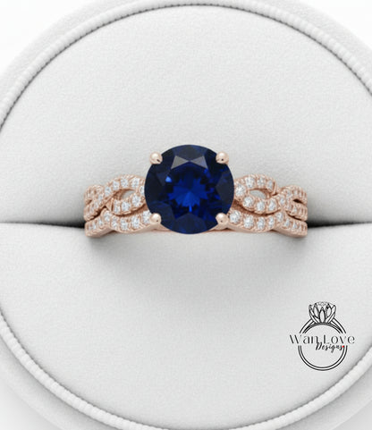 A gold ring with a large blue gemstone, possibly a sapphire, set in a delicate, intricate design.