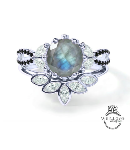A silver ring with a large blue gemstone at the center, surrounded by smaller diamonds and a floral design.