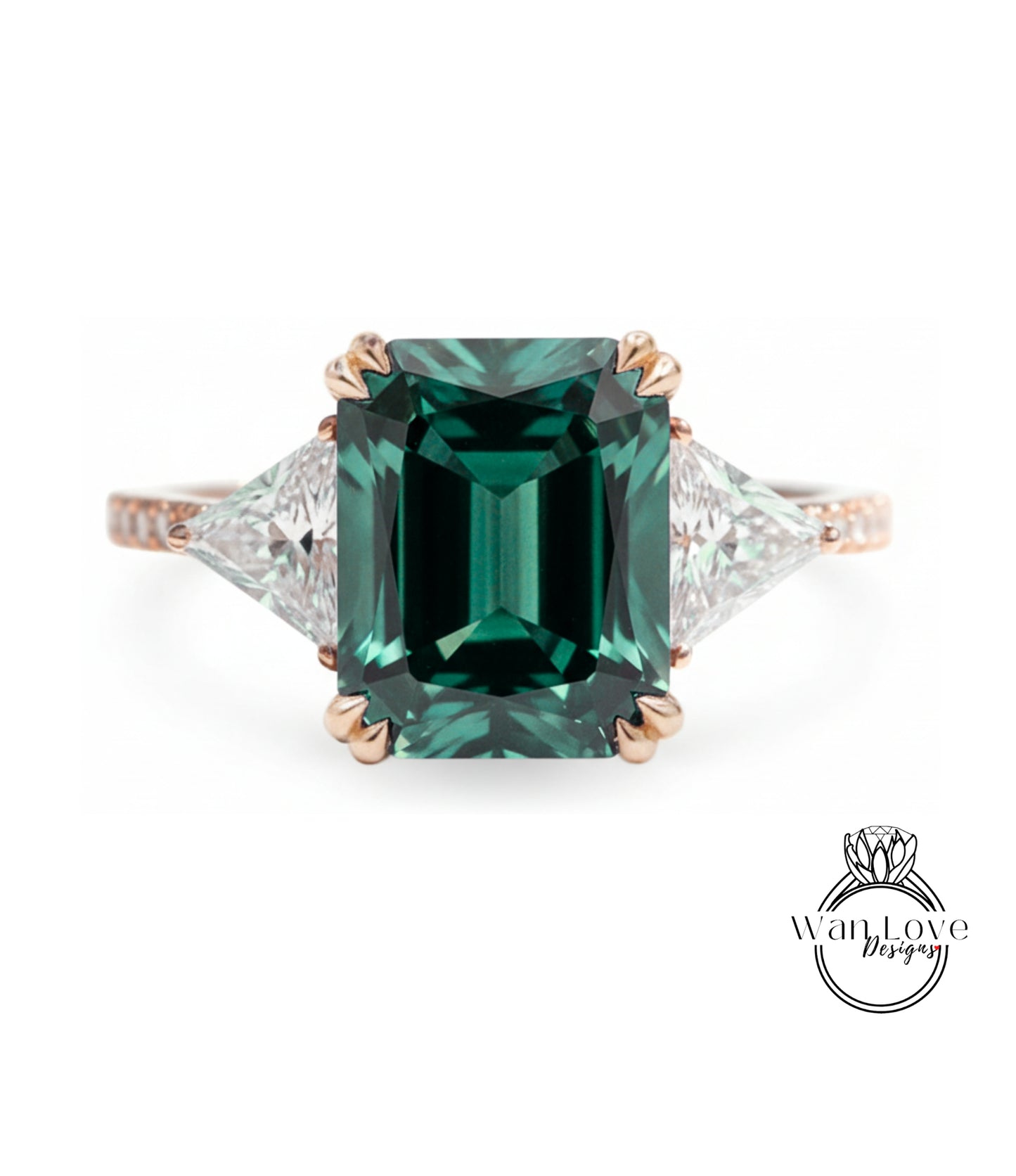 A large, green gemstone engagement ring with a gold band and three smaller diamonds on either side.