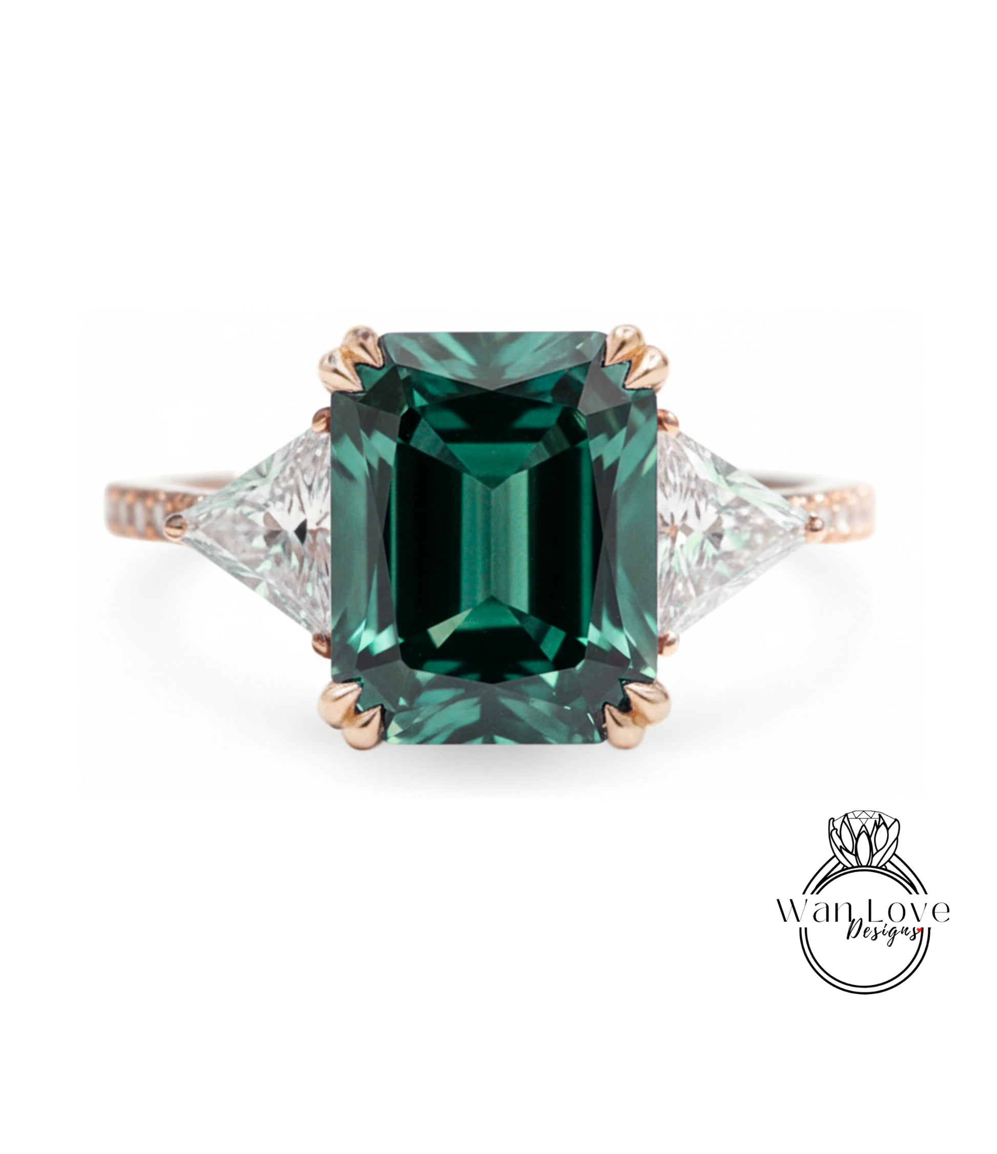 A large, green gemstone engagement ring with a gold band and three smaller diamonds on either side.
