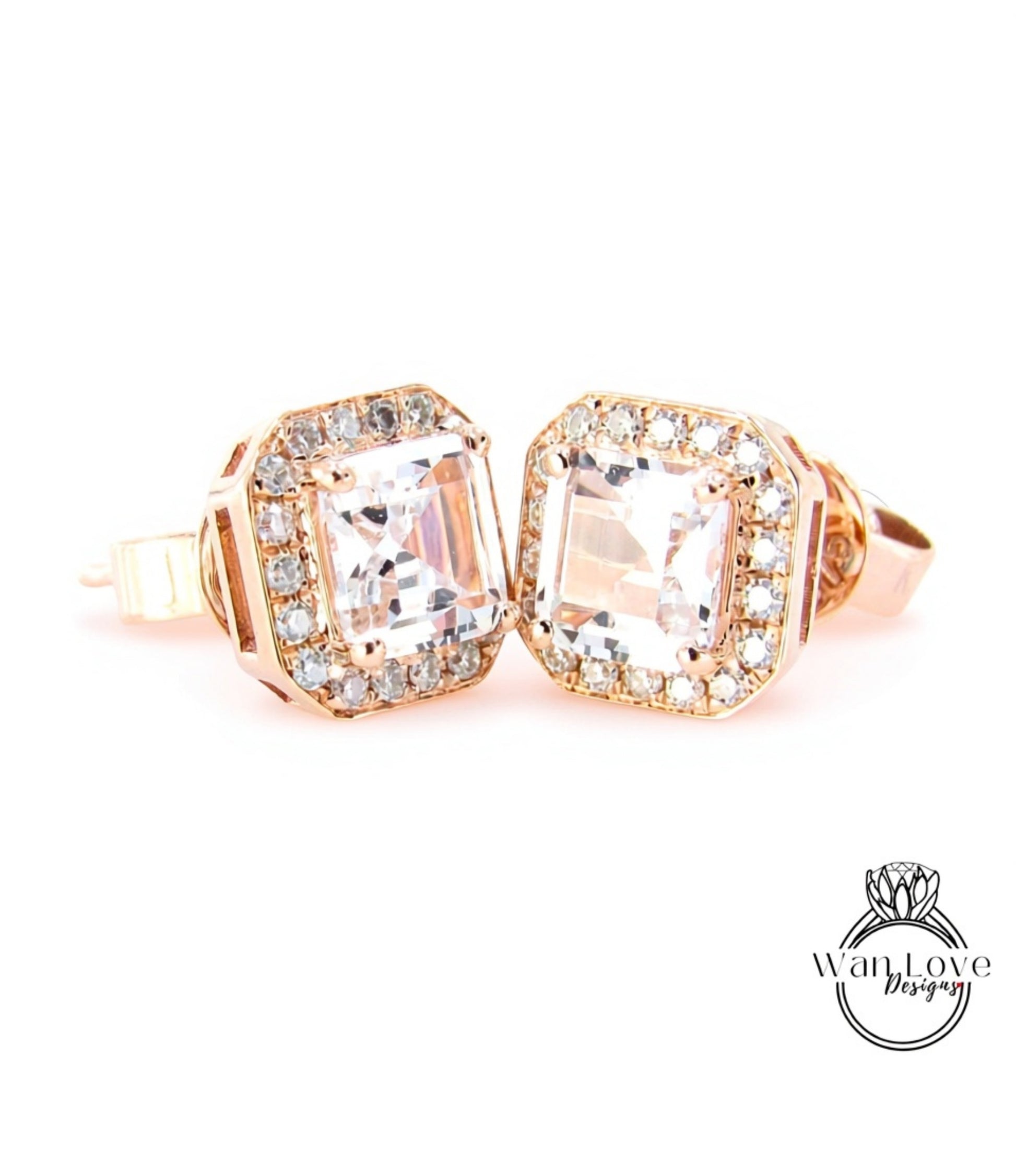 A pair of elegant gold earrings with large, clear gemstones set in a halo around the center.