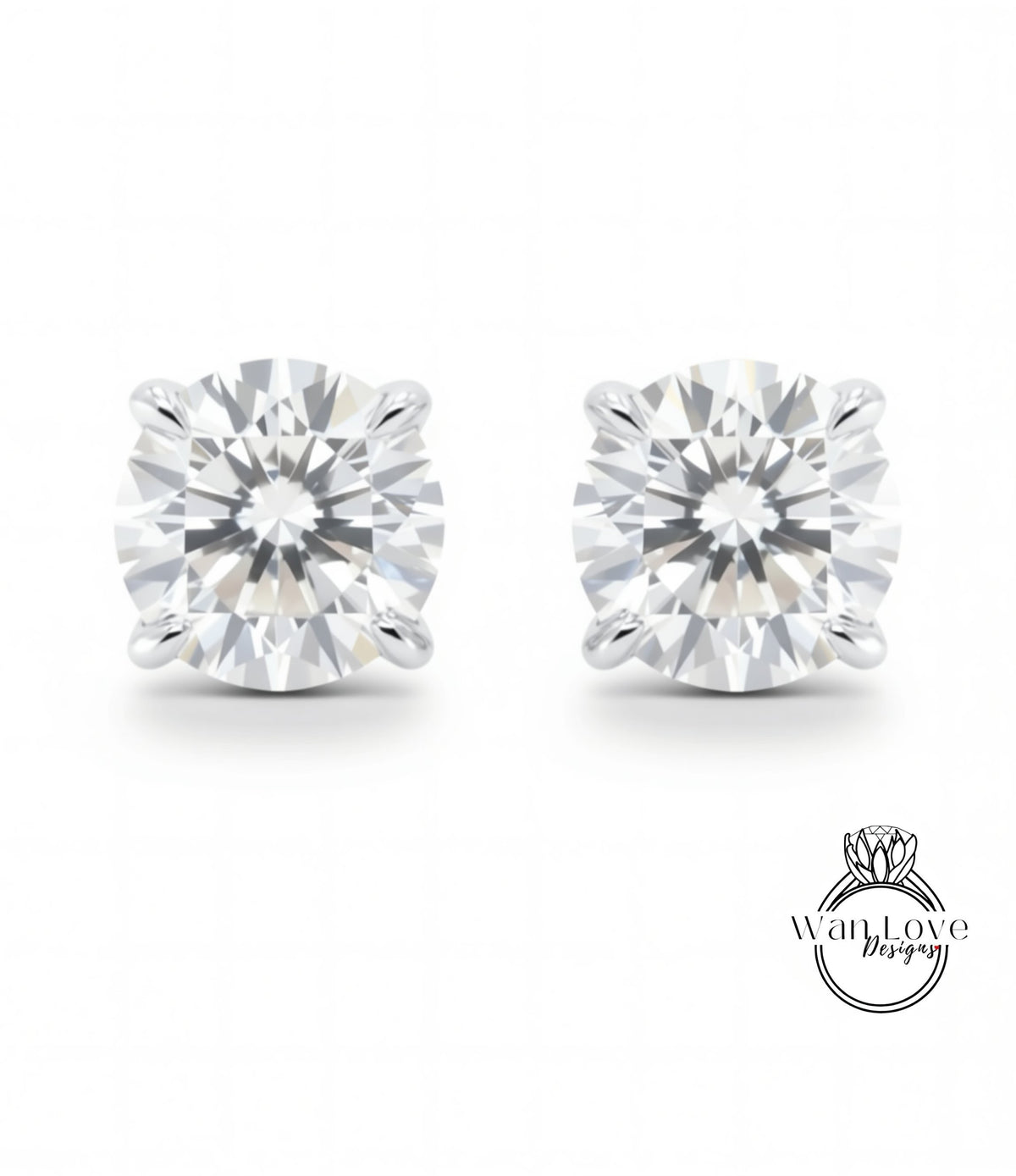 A pair of elegant diamond earrings with a large, brilliant-cut diamond set in a silver metal earring.