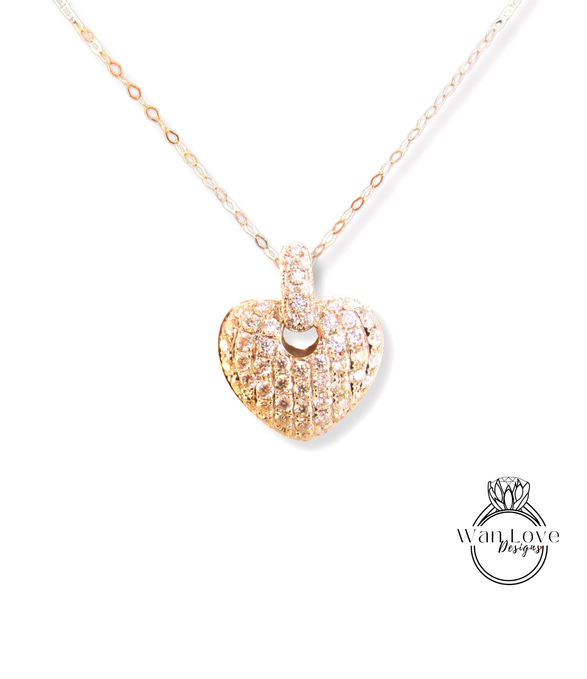 A delicate gold heart-shaped pendant necklace with a sparkling diamond design.