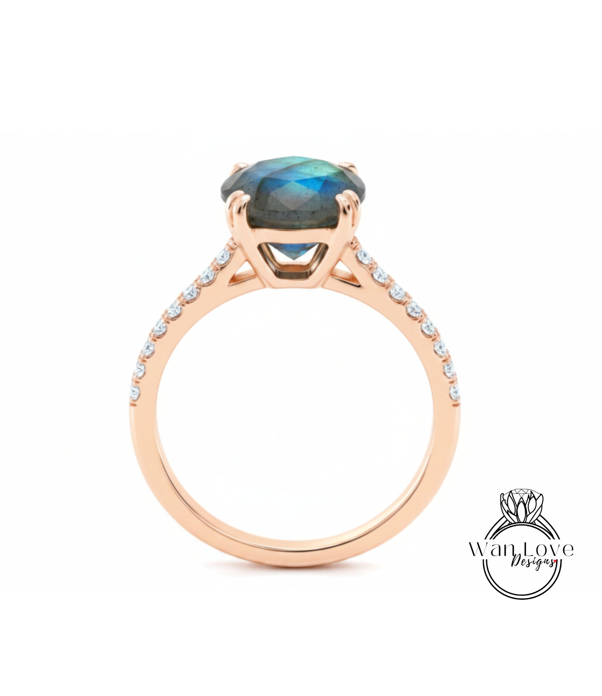 A gold ring with a large blue gemstone, likely a diamond, set in the center.