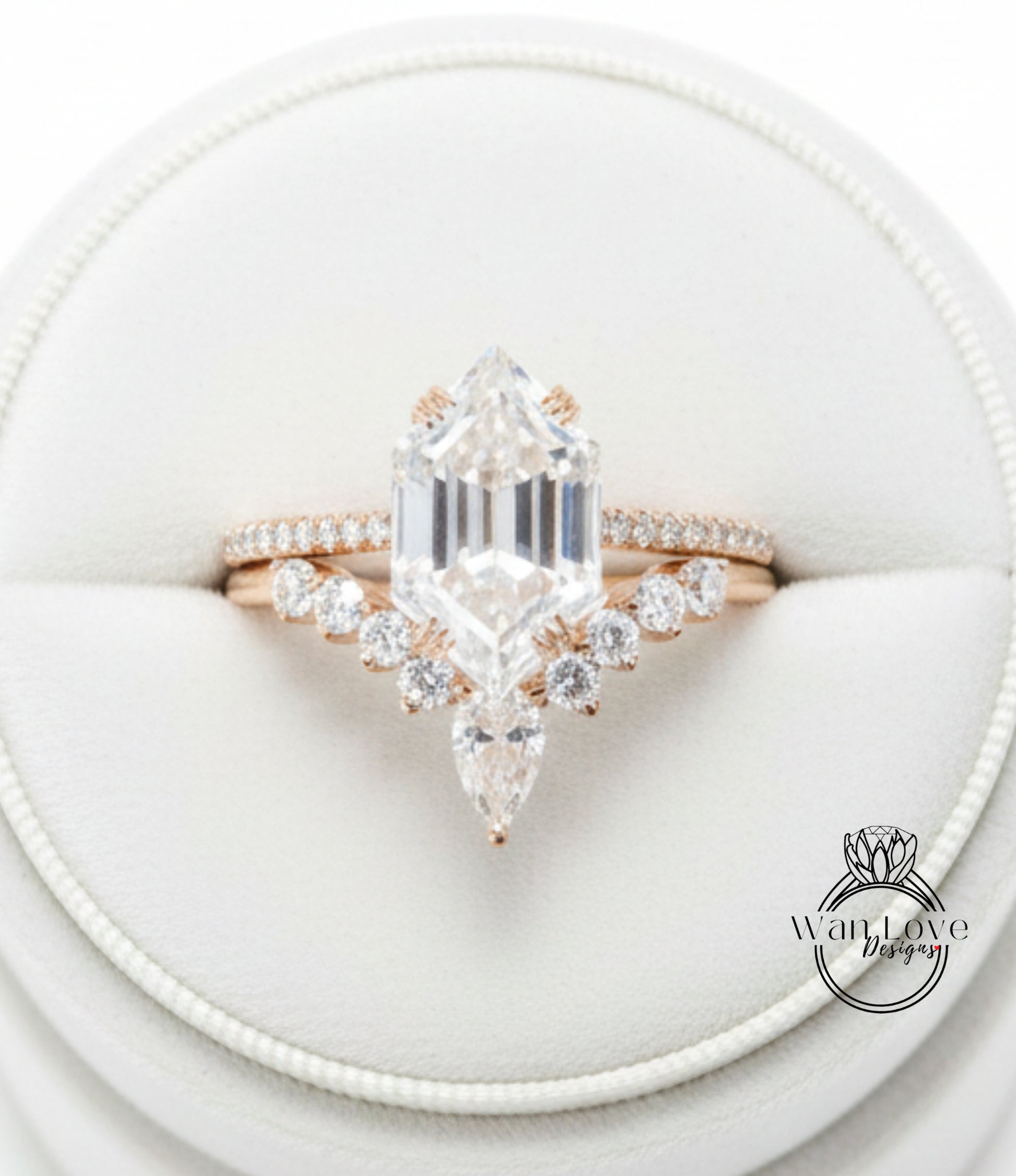 A close-up view of a diamond engagement ring displayed in a white jewelry box.