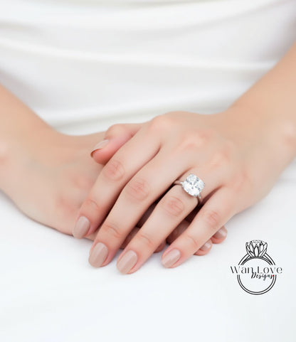 A close-up of a person's hands wearing a large diamond engagement ring.