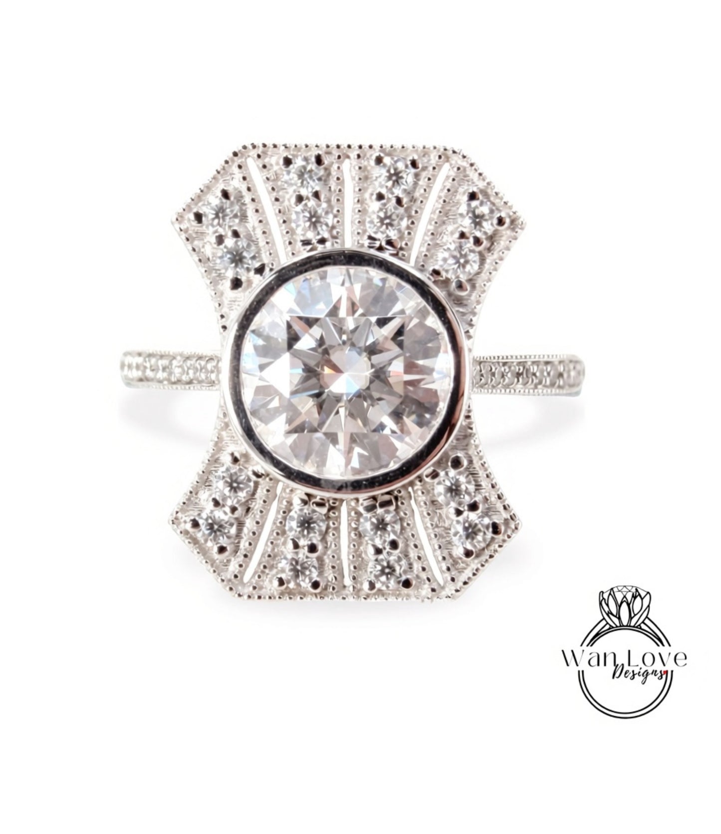 A diamond engagement ring with a large central diamond surrounded by smaller diamonds set in a decorative pattern.