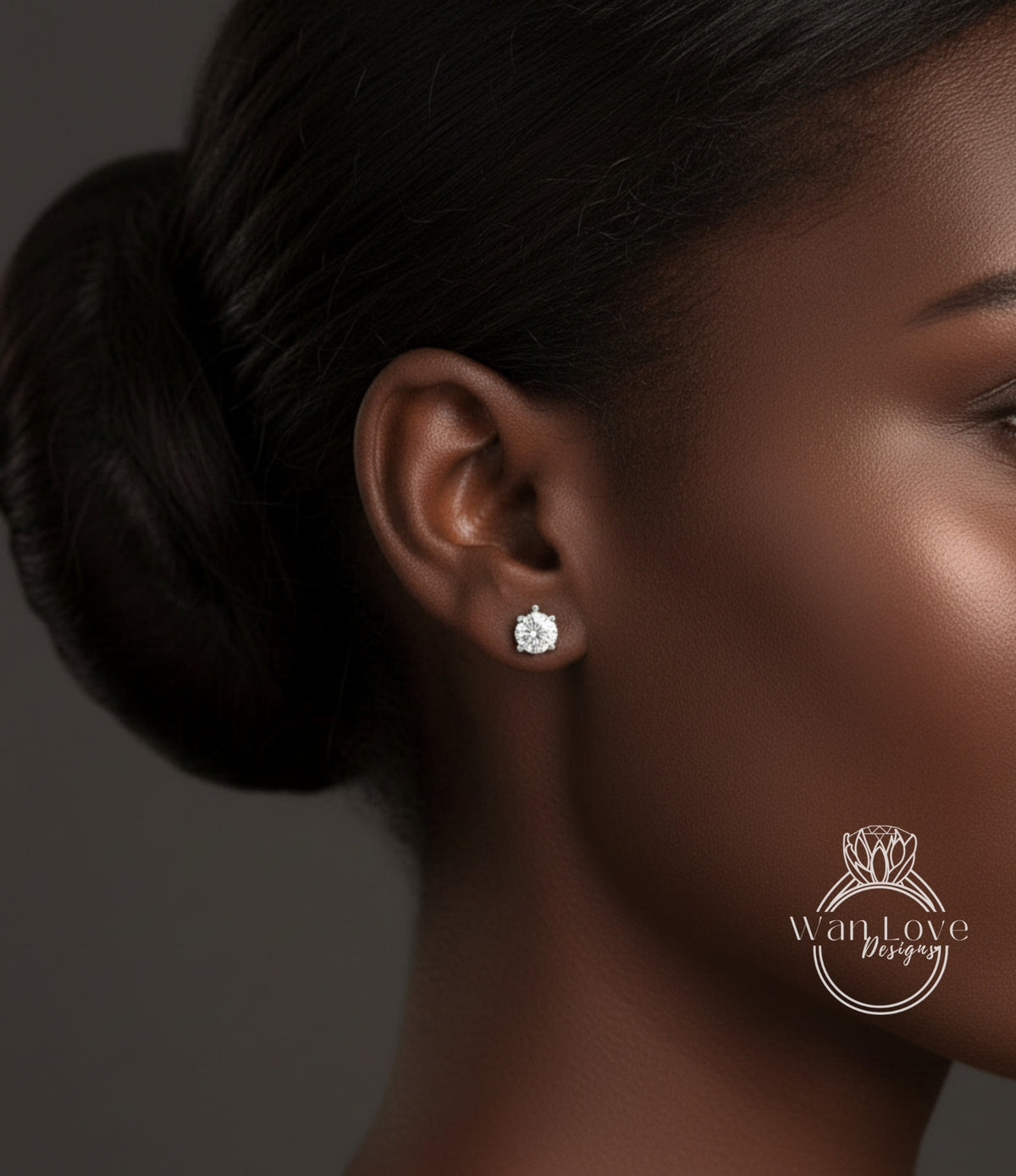 A close-up of a woman's ear with a diamond earring, showcasing the earring and the woman's face.