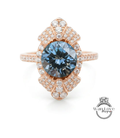 A rose gold ring with a large blue gemstone at the center, surrounded by smaller diamonds.