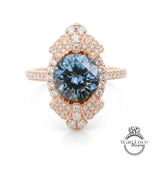 A rose gold ring with a large blue gemstone at the center, surrounded by smaller diamonds.