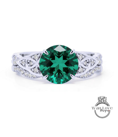 A silver ring with a large, bright green gemstone at the center.