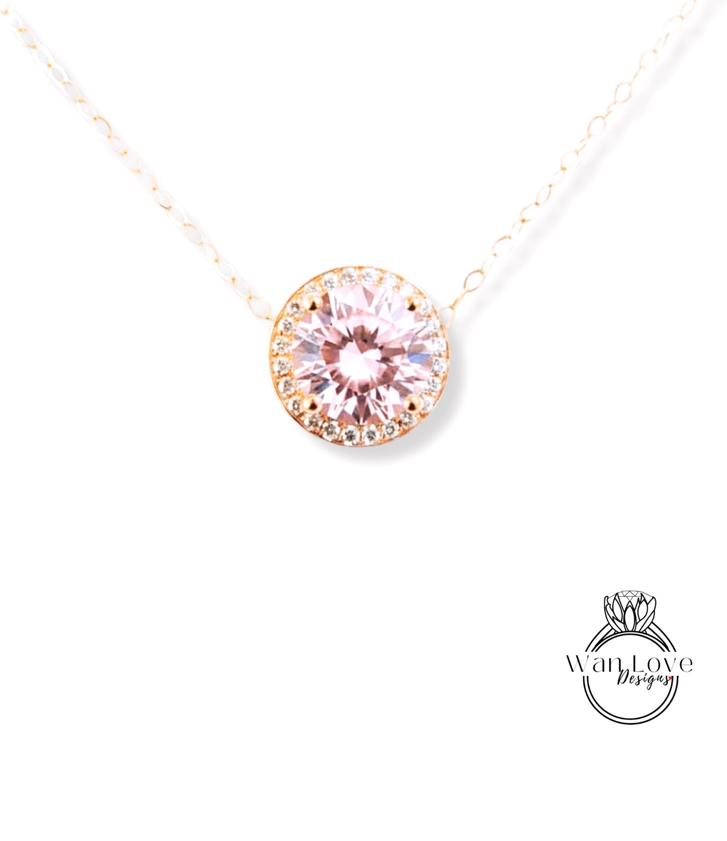 A necklace with a large, round, pink gemstone at the center, surrounded by a halo of smaller diamonds.