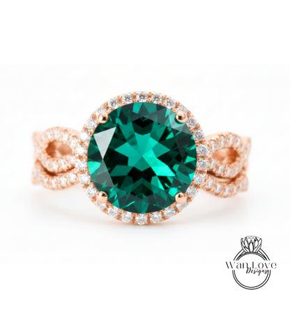 A large, oval-shaped green gemstone set in a rose gold ring with a halo of smaller diamonds around the edge.