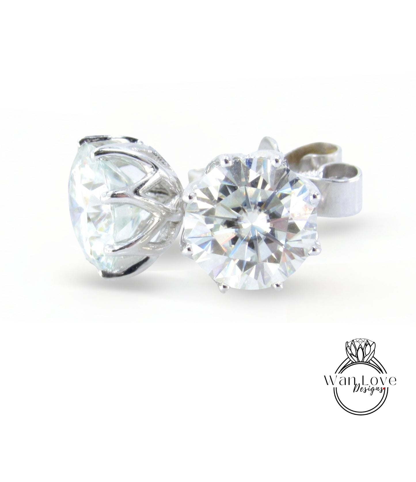 A close-up image of a large, clear diamond set in a silver earring.