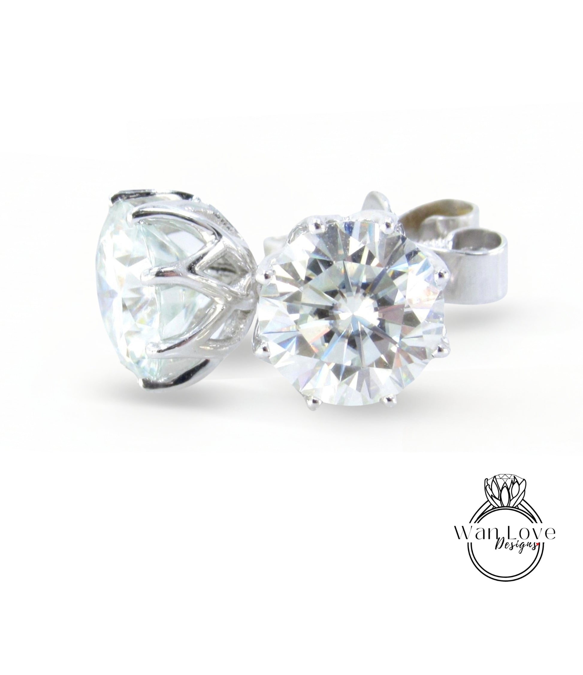 A close-up image of a large, clear diamond set in a silver earring.